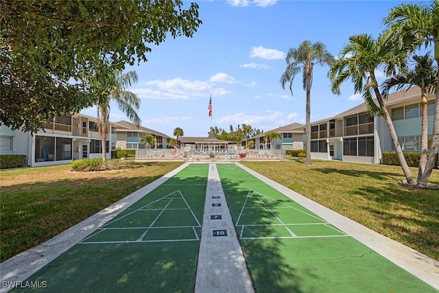 402 SE 42nd Ter Unit D-7, Cape Coral, FL 33904 - view of community featuring a residential view, shuffleboard, and a yard