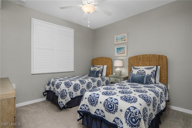 bedroom with carpet, a ceiling fan, and baseboards