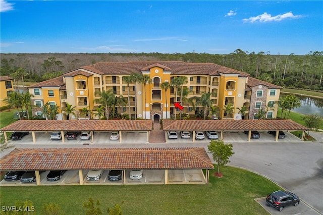 view of property featuring uncovered parking