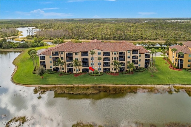 bird's eye view featuring a water view and a view of trees