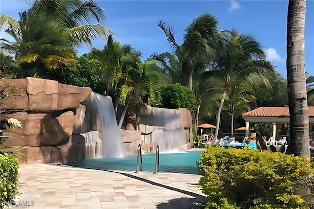 view of swimming pool with a gazebo