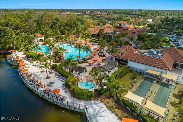 birds eye view of property with a water view