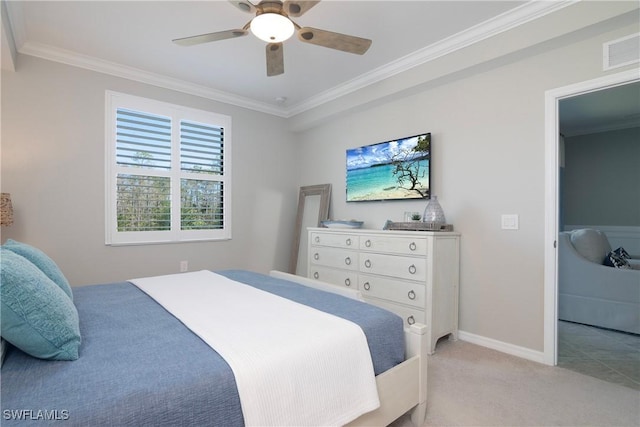 bedroom featuring crown molding, baseboards, visible vents, and light colored carpet