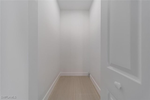 interior space featuring baseboards