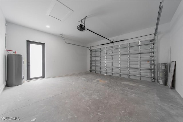 garage featuring a garage door opener and water heater