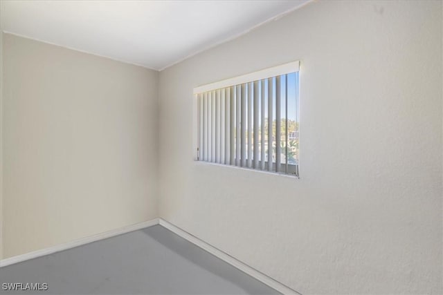 spare room featuring concrete floors