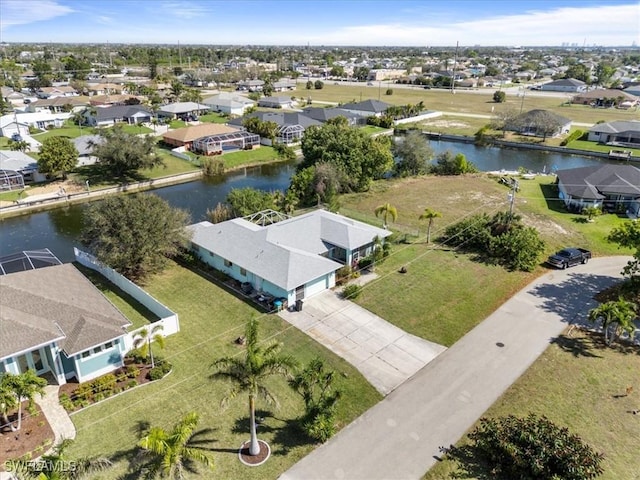 bird's eye view with a water view and a residential view