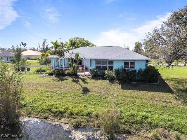 view of front of house with a front yard and fence