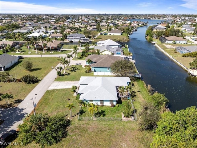 birds eye view of property with a residential view and a water view