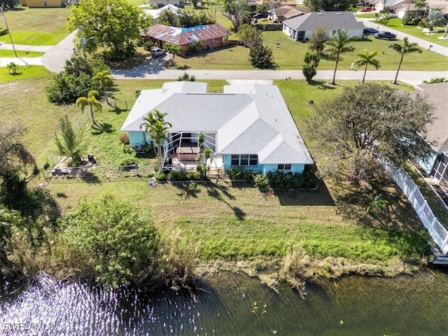 birds eye view of property featuring a water view and a residential view