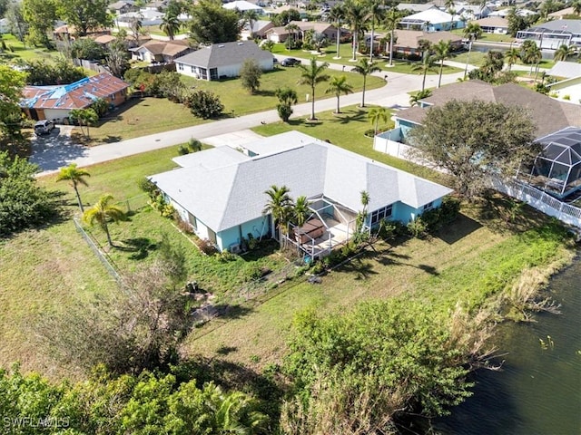 aerial view with a water view and a residential view