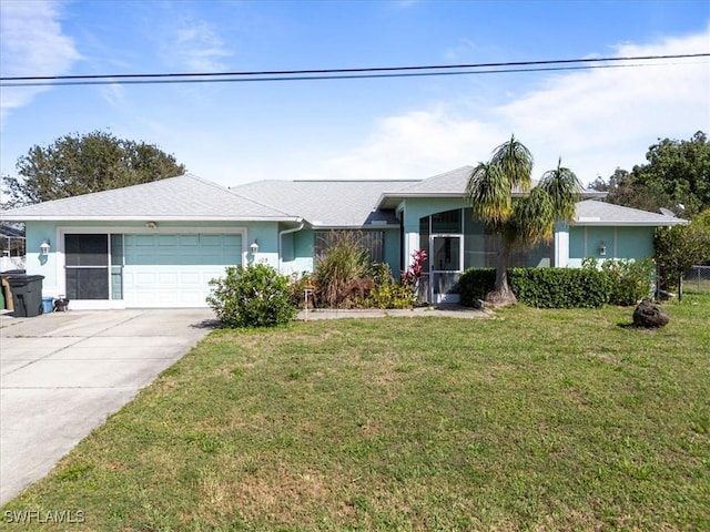 ranch-style home with a garage, a front yard, driveway, and stucco siding