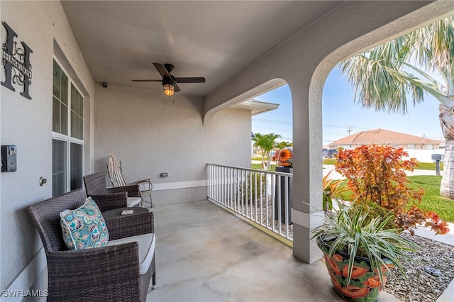 balcony featuring ceiling fan