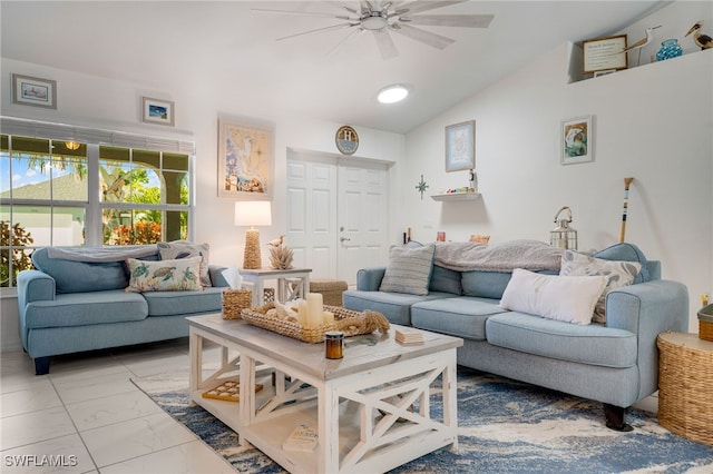 living area with lofted ceiling, marble finish floor, and ceiling fan