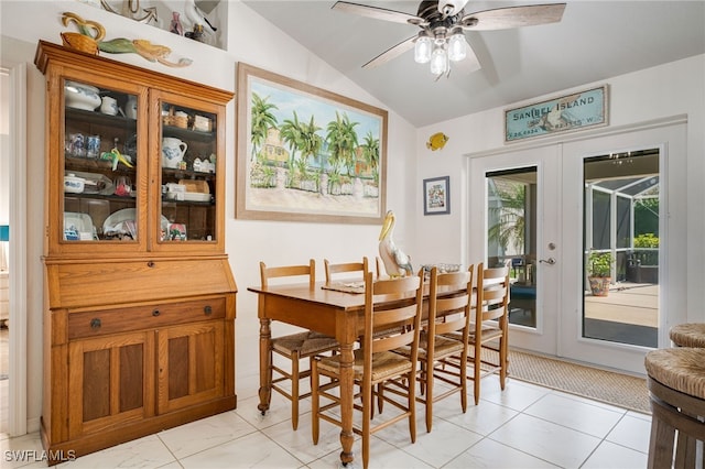 dining room featuring vaulted ceiling, ceiling fan, and french doors