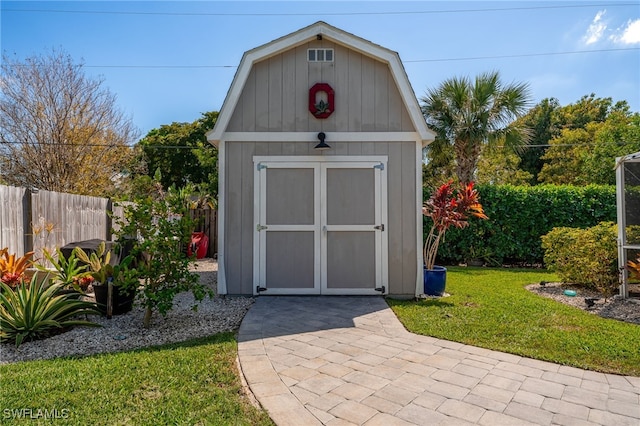 view of shed with fence