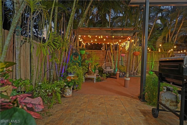 view of patio / terrace with a fenced backyard and a pergola