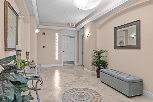 entryway featuring marble finish floor, crown molding, and baseboards