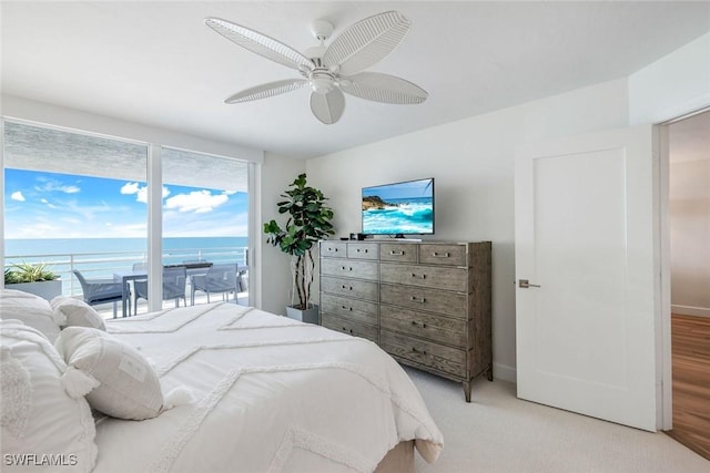 780 S Collier Blvd Unit 708, Marco Island, FL 34145 - bedroom with light carpet, a ceiling fan, baseboards, and access to outside