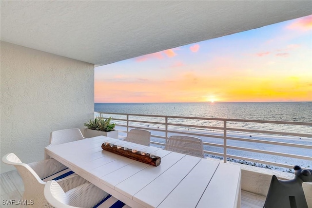 780 S Collier Blvd Unit 708, Marco Island, FL 34145 - balcony featuring outdoor dining area and a water view