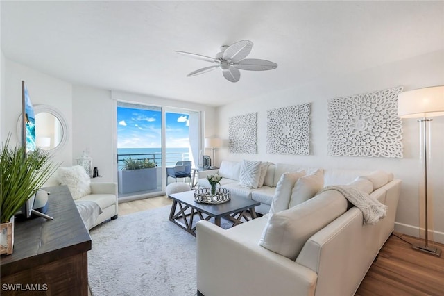 780 S Collier Blvd Unit 708, Marco Island, FL 34145 - living room featuring ceiling fan, baseboards, and wood finished floors