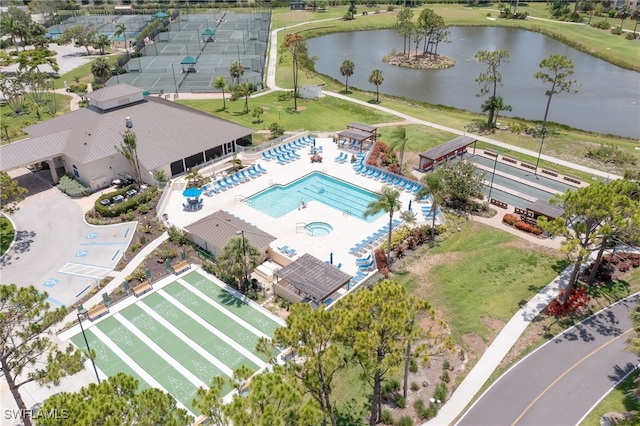 birds eye view of property with a water view