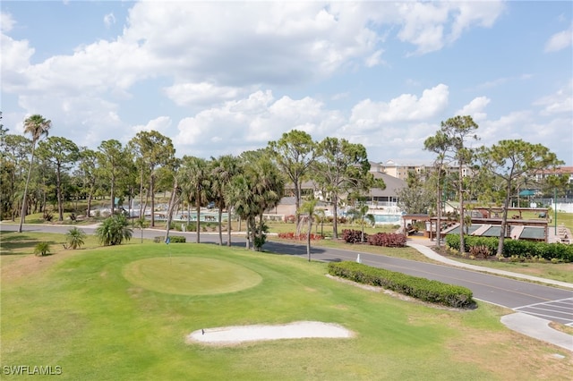 view of community featuring view of golf course