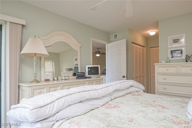 bedroom with visible vents and two closets