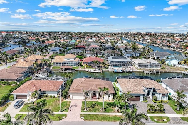 birds eye view of property featuring a residential view and a water view