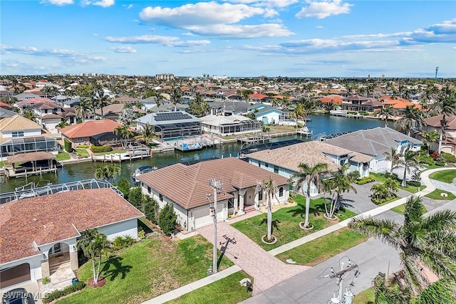 bird's eye view with a water view and a residential view