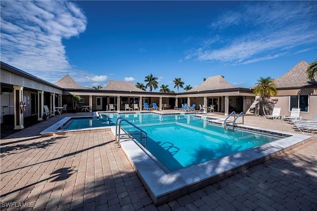 community pool featuring a patio area