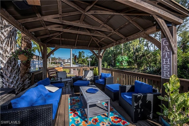 deck with outdoor lounge area and a gazebo