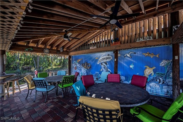 view of patio featuring ceiling fan and outdoor dining space