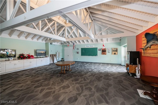 interior space with high vaulted ceiling, carpet, and beam ceiling