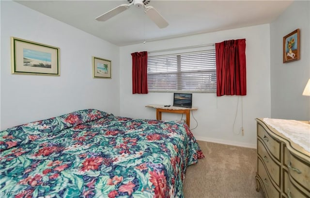 bedroom featuring carpet floors, baseboards, and a ceiling fan