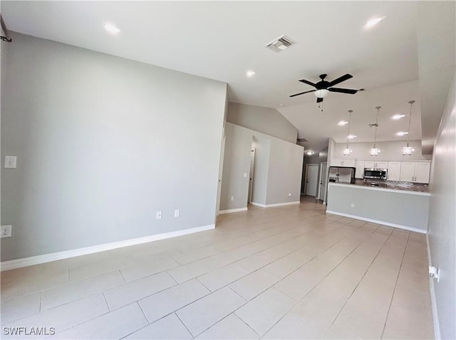 unfurnished living room featuring baseboards, visible vents, a ceiling fan, vaulted ceiling, and recessed lighting