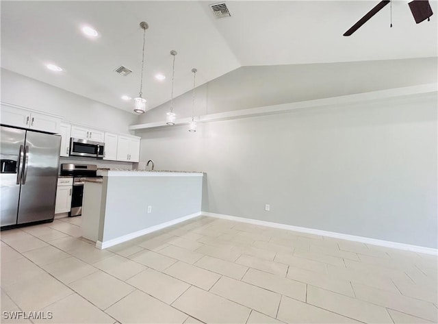 kitchen with a peninsula, white cabinetry, visible vents, and stainless steel appliances