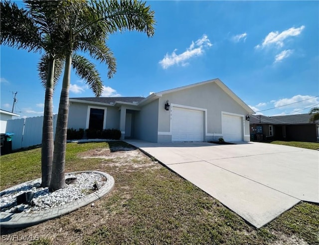 single story home with stucco siding, an attached garage, fence, driveway, and a front lawn