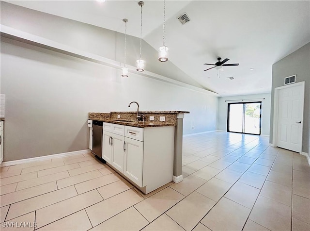 kitchen featuring a peninsula, a sink, visible vents, stainless steel dishwasher, and dark stone countertops