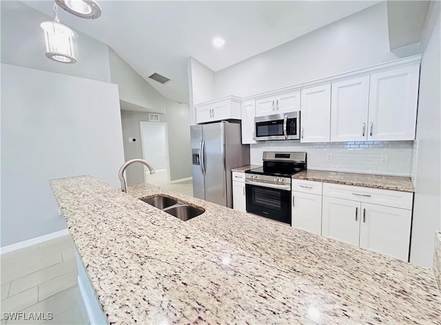 kitchen with a sink, white cabinetry, visible vents, appliances with stainless steel finishes, and tasteful backsplash