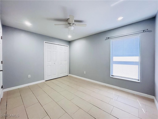 unfurnished bedroom with a closet, baseboards, a ceiling fan, and recessed lighting