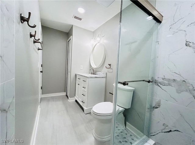 bathroom featuring toilet, a stall shower, vanity, and visible vents