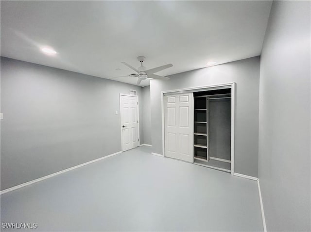 unfurnished bedroom with recessed lighting, a closet, ceiling fan, concrete floors, and baseboards