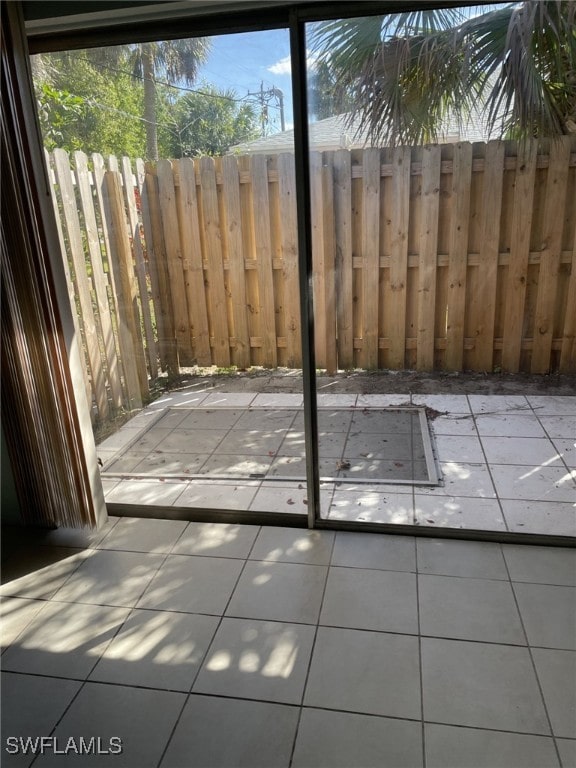 doorway featuring light tile patterned floors