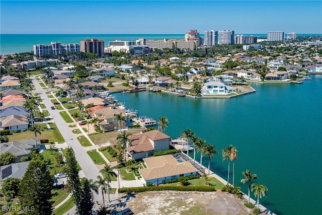 drone / aerial view featuring a water view and a city view