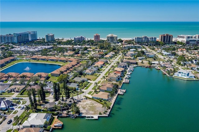 bird's eye view featuring a water view and a city view