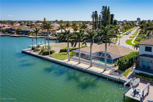 bird's eye view featuring a water view and a residential view