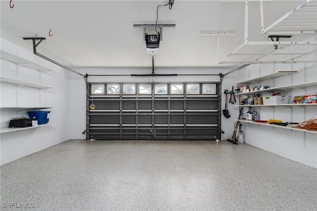 garage featuring a garage door opener