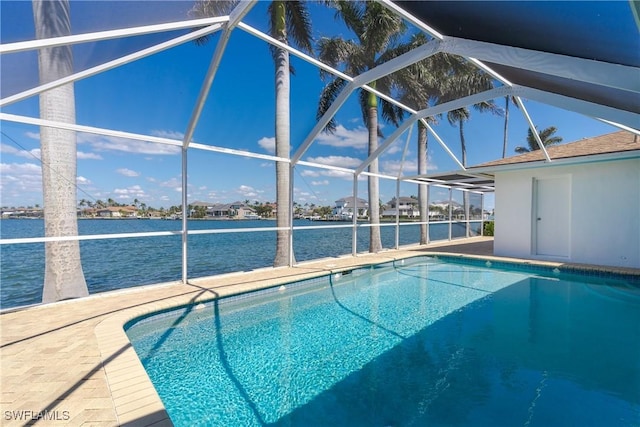 pool with glass enclosure and a patio