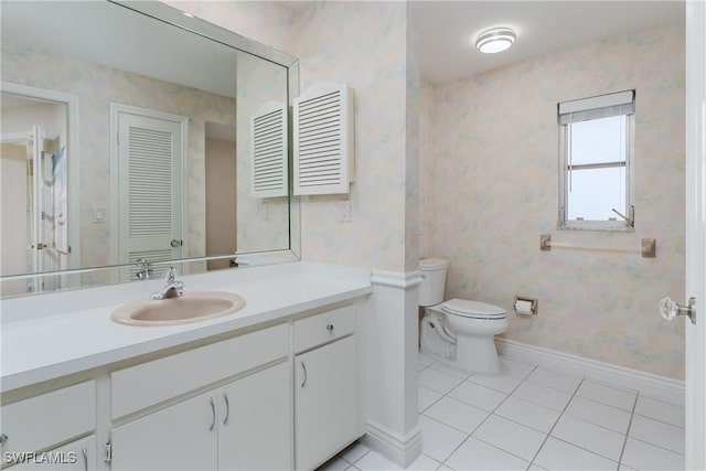 bathroom featuring toilet, wallpapered walls, and tile patterned flooring